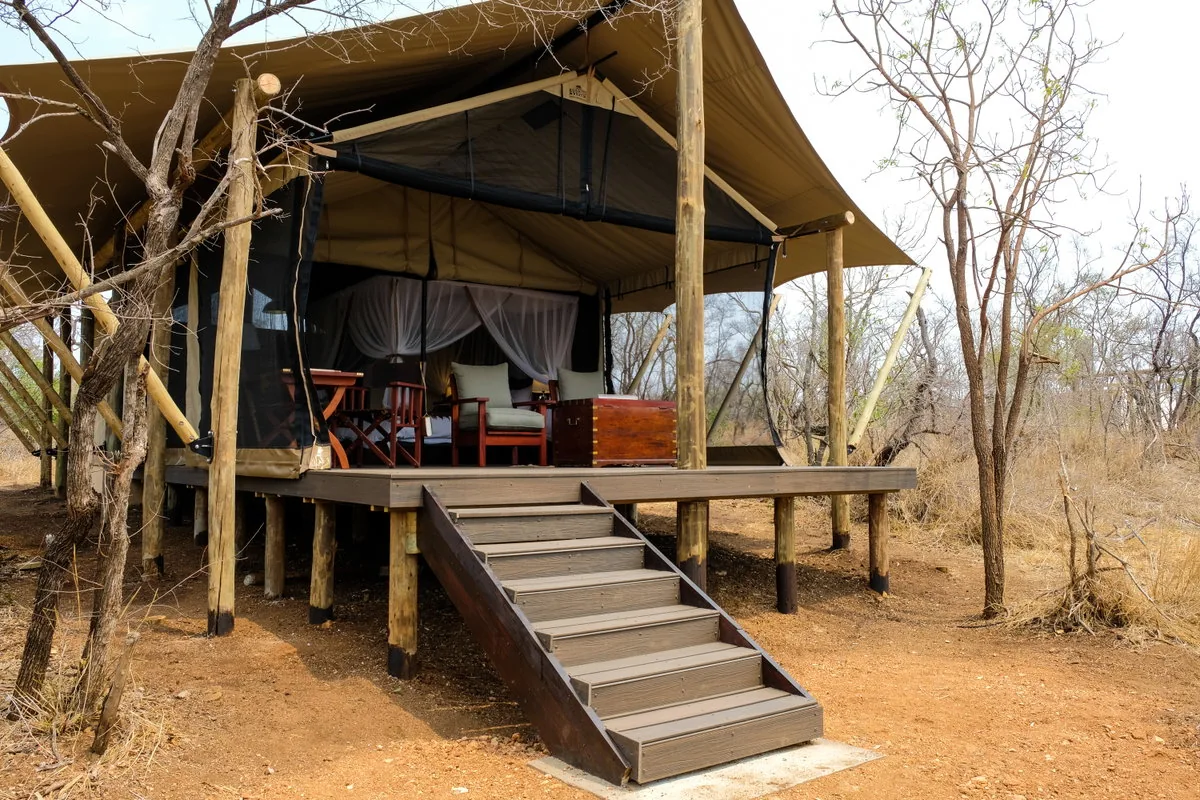 Elevated canvas suite and deck at Honeyguide Mantobeni Camp